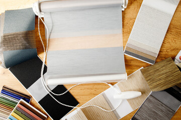 Samples of fabrics of different textures and colors in the form of a catalog for the selection of...