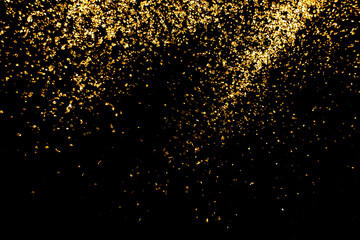 close up of the golden  glitte on black background