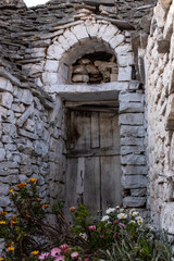 Fototapeta na wymiar Door of an abandoned Trullo house in Alberobello, Southern Italy