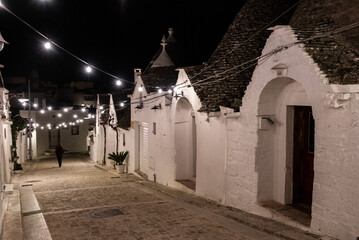 Scenic abandoned street in the Trulli district of Alberobello, Italy