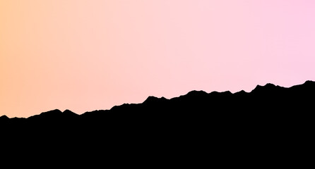 Black silhouette of a relief of a mountain rising up against a bright pink-orange sky background.Abstract silhouette of a mountain.3D render.