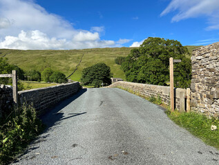 View over the old stone bridge, on a late afternoon, in the Yorkshire Dales hamlet of, Halton Gill