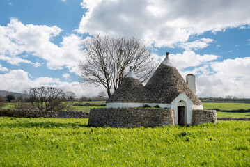 Scenic Trullo dwelling in the rural landscape near Alberobello, Italy
