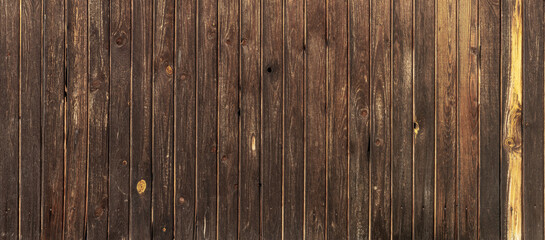Dark, high-resolution background. Vertical brown boards