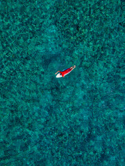 Aerial view of surfer in Indian Ocean. Maldives