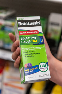 Los Angeles, CA, USA, June 29th 2022 Shopper hand holding a box of Robitussin brand Maximum Strength Nighttime cough DM medicine