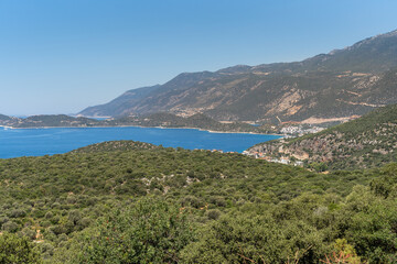 Fototapeta na wymiar Aerial view of touristic Kas district with its green nature and deep blue sea. Antalya - Turkey 
