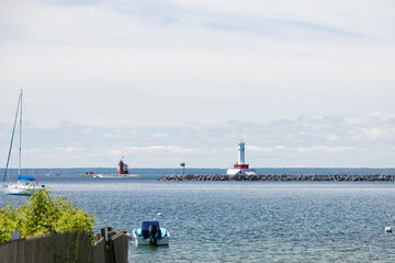 Boats in the bay with Round Island Passage Light in foreground and Round Island Light in background