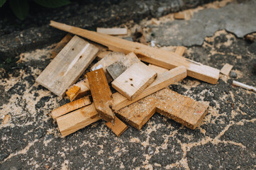 Background, texture of sawn wooden boards, bars with sawdust after a sawmill. - obrazy, fototapety, plakaty
