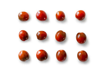 Closeup of fresh juicy organic red cherry tomatoes from the garden on isolated white background from above