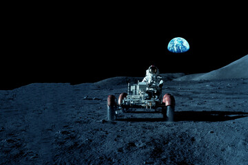 An astronaut rides on a lunar rover on the moon. Elements of this image furnished by NASA