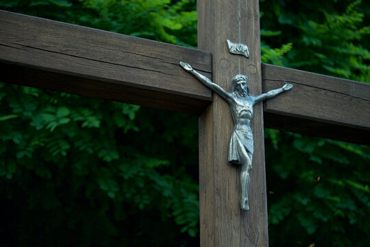 Silver Jesus Corpus Crucifix on wooden cross