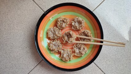 Siomay on a rainbow plate ready to eat