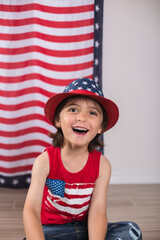 child wearing 4th of july clothes and hat celebrating studio photo copy space 