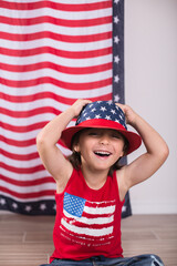 child wearing 4th of july clothes and hat celebrating studio photo copy space 