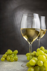 Glass of white wine on the table.