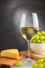 Glass of white wine on the table.