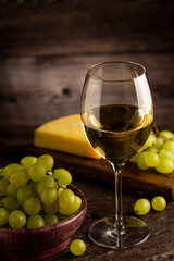 Glass of white wine on the table.