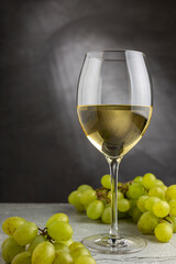 Glass of white wine on the table.
