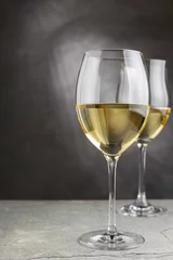 Foto op Aluminium Glass of white wine on the table. © WS Studio