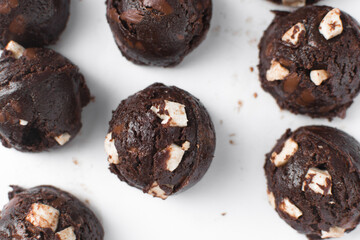 Top view of mini marshmallow chocolate chip cookie dough scoops on white parchment paper