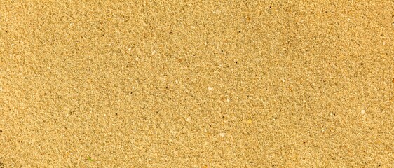 Panorama of Sand texture. Sandy beach for background. Top view. Natural sand stone texture background. sand on the beach as background. Wavy sand background for summer designs