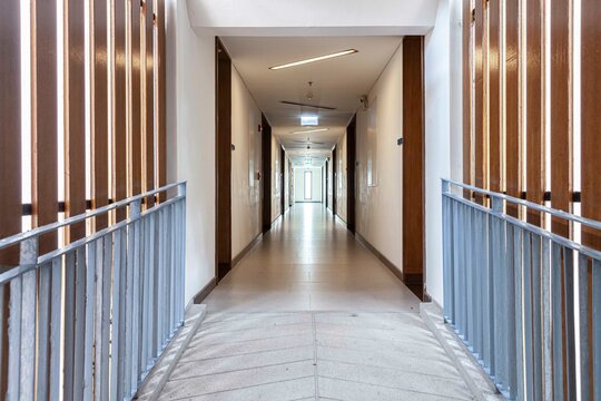 Long corridors between rooms inside a modern building