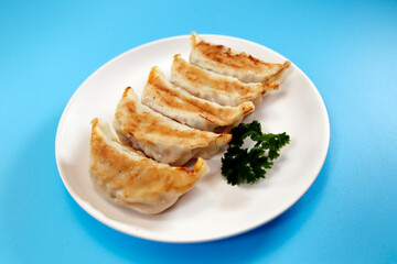 Freshly baked dumplings with plenty of gravy on the table