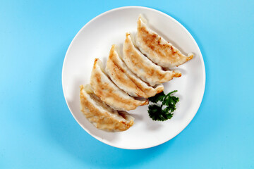Freshly baked dumplings with plenty of gravy on the table