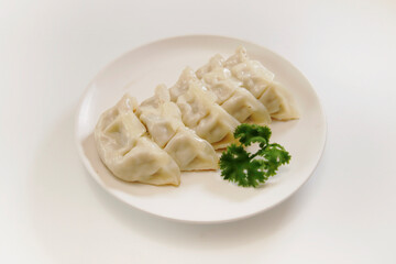 Freshly baked dumplings with plenty of gravy on the table
