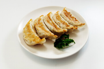 Freshly baked dumplings with plenty of gravy on the table