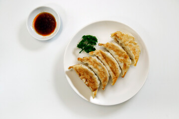 Freshly baked dumplings with plenty of gravy on the table