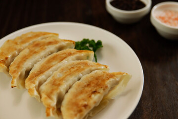 Freshly baked dumplings with plenty of gravy on the table