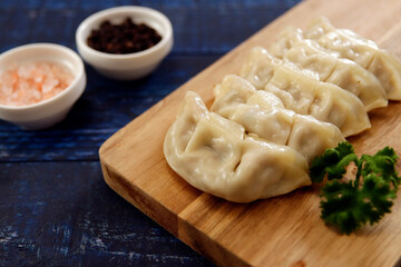 Freshly baked dumplings with plenty of gravy on the table