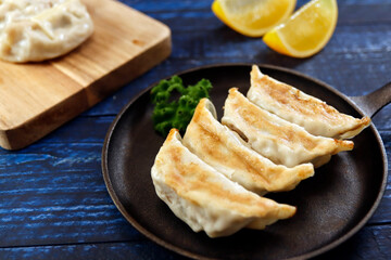 Freshly baked dumplings with plenty of gravy on the table