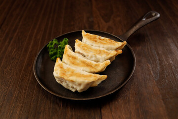 Freshly baked dumplings with plenty of gravy on the table