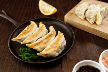 Freshly baked dumplings with plenty of gravy on the table