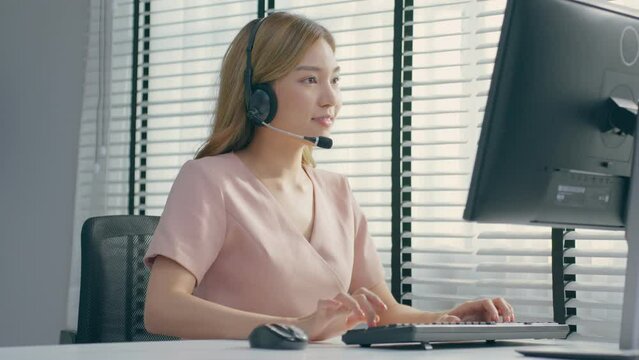 Asian beautiful business woman call center working in office workplace