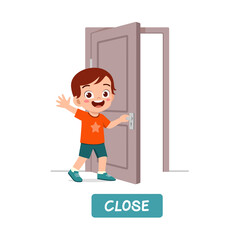 little kid standing and holding door knob