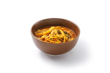 Red curry preserved bamboo shoot in bowl isolated on white background.