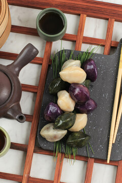 Traditional Chuseok Day Food, Korean Half Moon Shaped Rice Cake or Songpyeon. Made from Korean Rice Flour with Sesame Seed