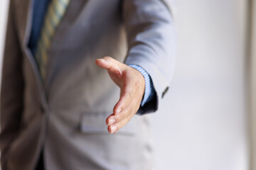 Obraz premium Business handshake for teamwork of business merger and acquisition,successful negotiate,hand shake,two businessman shake hand with partner to celebration partnership and business deal concept