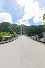 bridge with mountains and sky