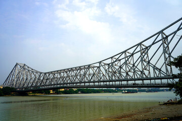 The Howrah Bridge is a balanced cantilever bridge over the Hooghly River in West Bengal, India.