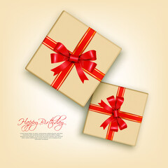Happy Birthday decorations glowing sequins and craft paper gift box with red ribbon bow on isolated red background