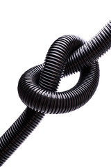 Knotted construction vacuum cleaner hose, vertical photo