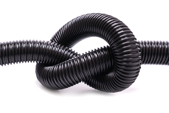 Knotted flexible black corrugated vacuum cleaner hose
