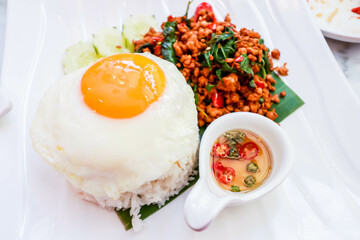 Rice topped with stir-fried pork and basil and a fried egg