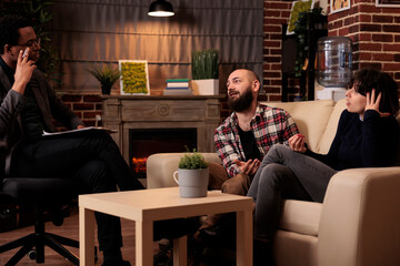 Man and woman with problems attending therapy session with psychologist, asking for professional relationship advice and support. Talking about difficulties and counseling help.