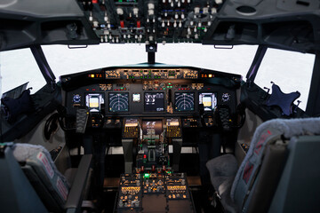 Nobody in empty captain cabin with dashboard navigation and engine throttle to fly airplane and...